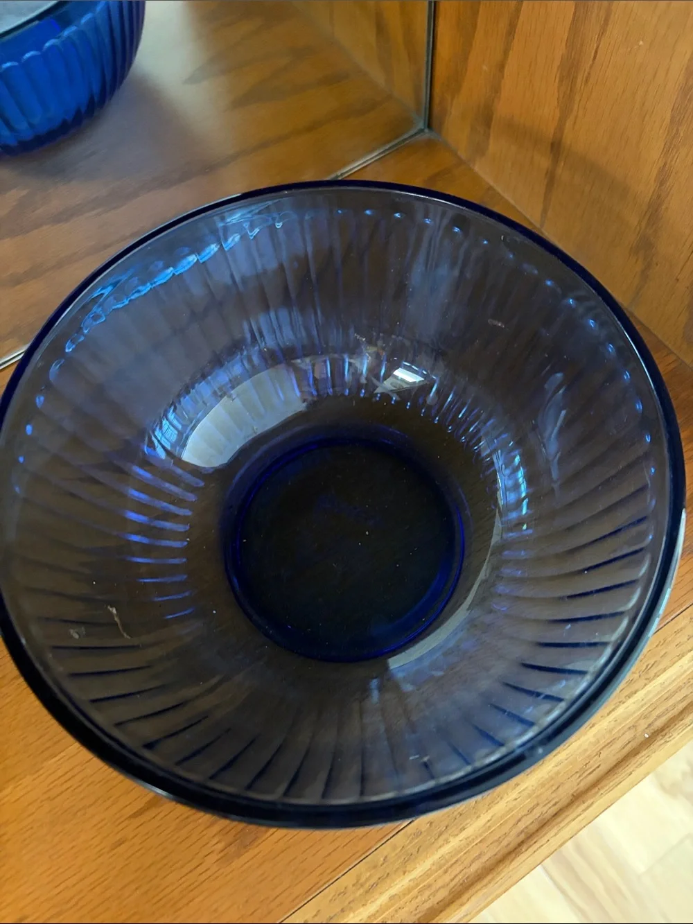 A vintage Pyrex Sculptured mixing bowl in cobalt blue glass.